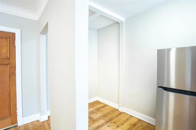 a view of a living room with a refrigerator