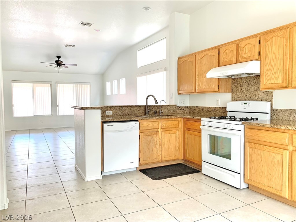 3821 Bombastic Court Las Vegas, NV 89147 - Photo 20 of 36 This spacious kitchen offers an open layout, ideal for culinary creations and seamless entertaining.