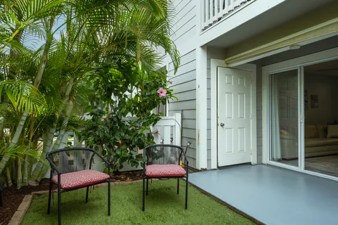 a patio with table and chairs