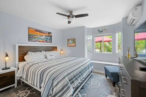 a bedroom with a bed and a desk
