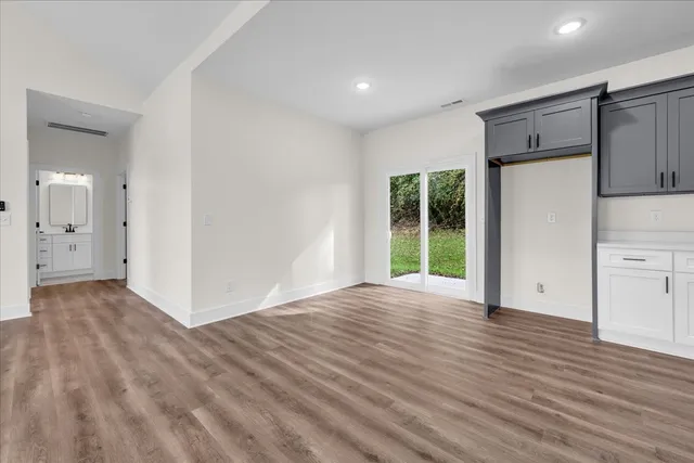 a view of a livingroom with wooden floor