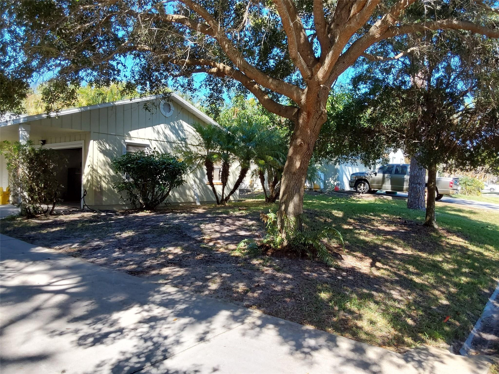 722 Wentworth Street Sebastian, FL 32958 - Photo 2 of 16 a view of a tree in front of a house