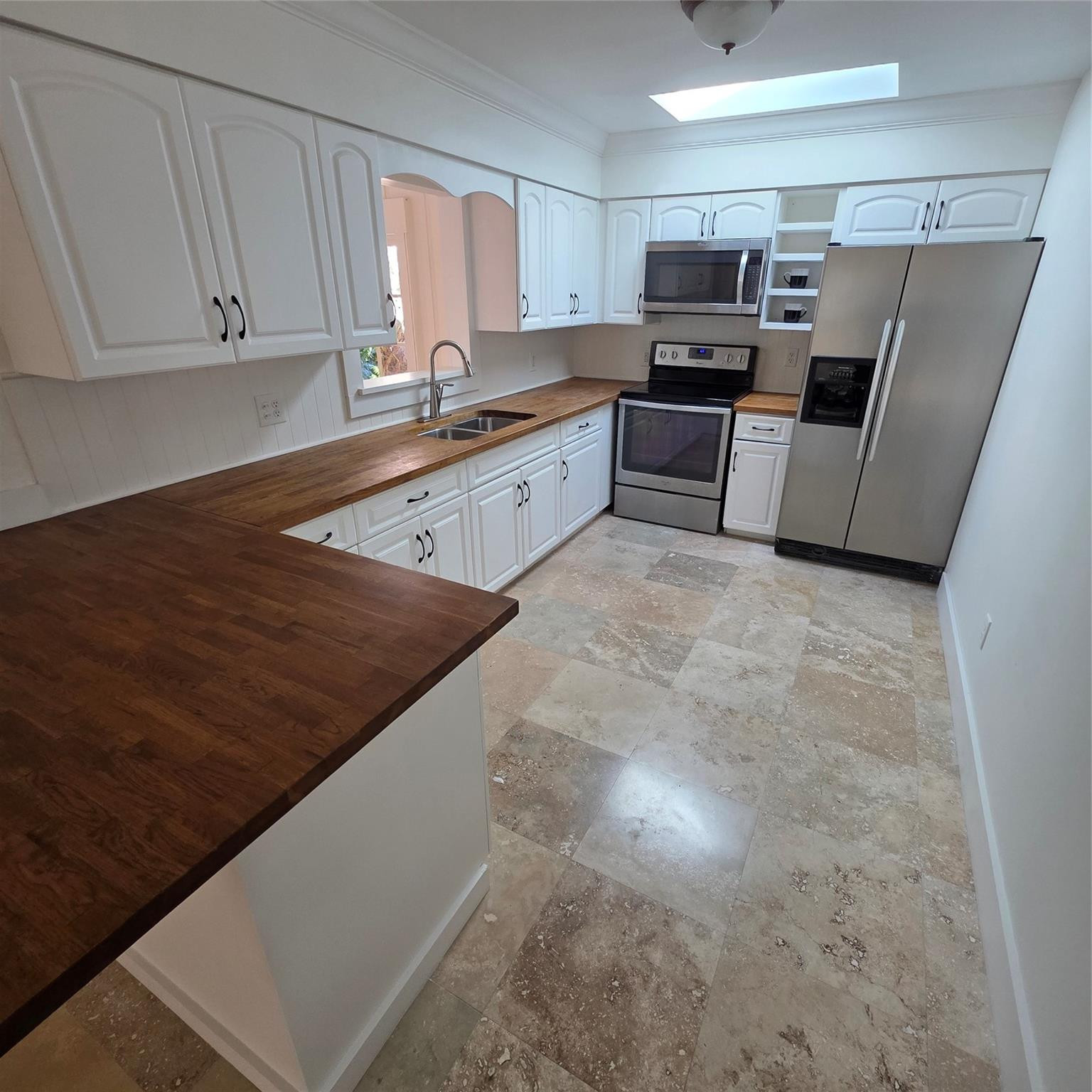 722 Wentworth Street Sebastian, FL 32958 - Photo 10 of 16 a kitchen with refrigerator and cabinets