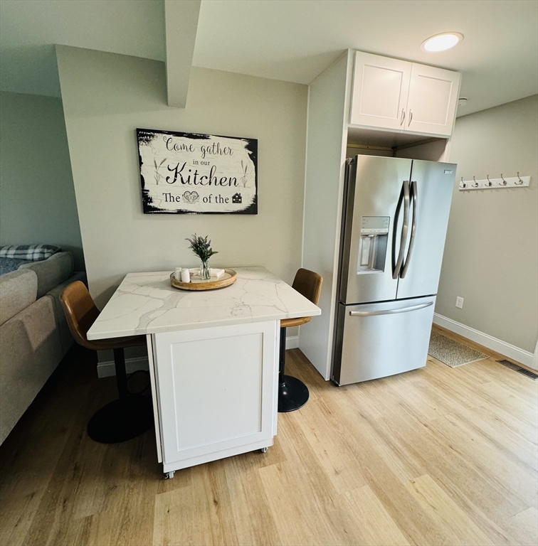 31 Deane Road Bernardston, MA 01337 - Photo 14 of 35 a kitchen with stainless steel appliances a dining table and wooden floor