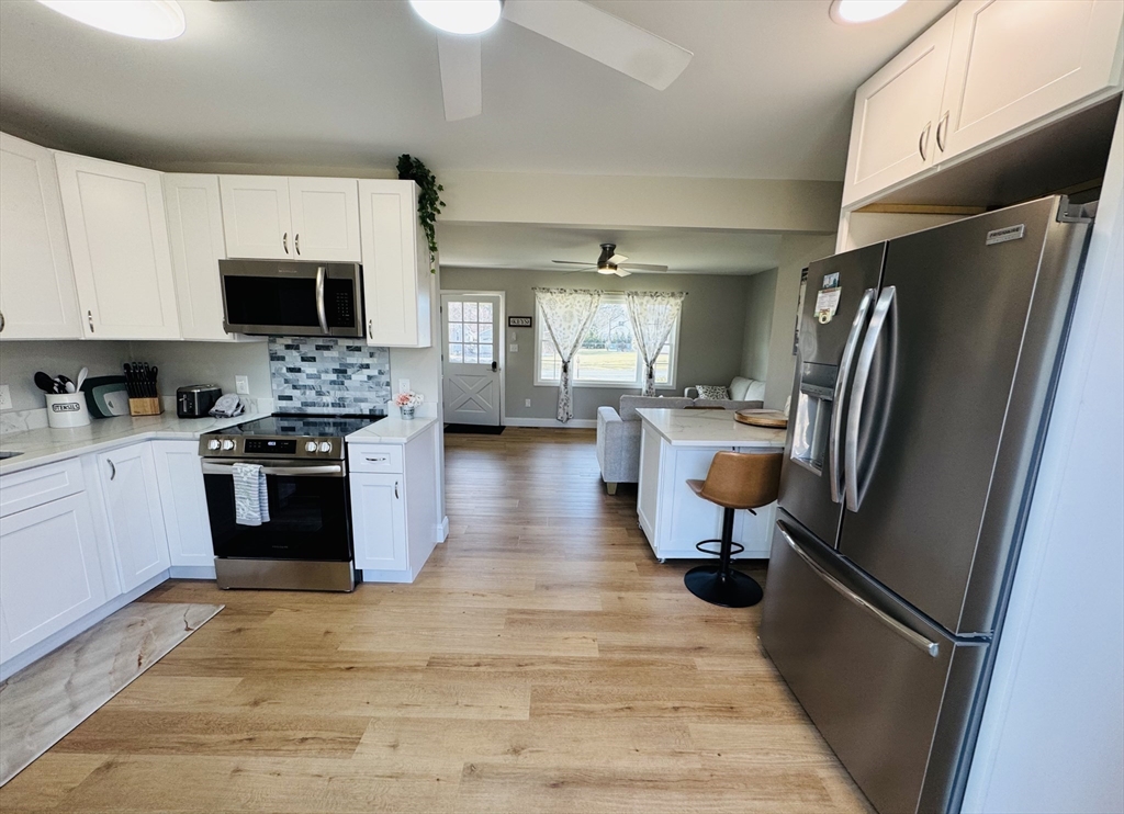 31 Deane Road Bernardston, MA 01337 - Photo 15 of 35 a kitchen with stainless steel appliances a stove a sink and a refrigerator