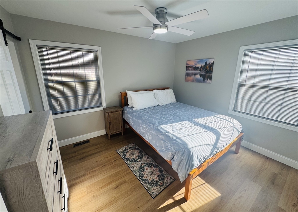 31 Deane Road Bernardston, MA 01337 - Photo 22 of 35 a bedroom with a bed a dresser and a window