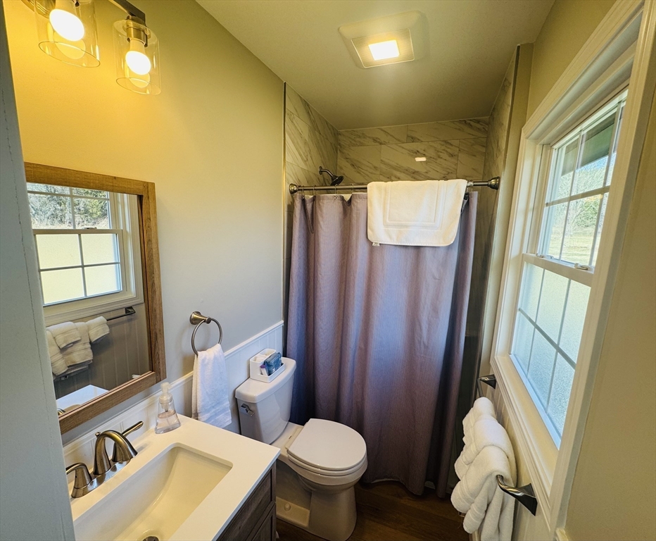31 Deane Road Bernardston, MA 01337 - Photo 28 of 35 a bathroom with a toilet sink and mirror