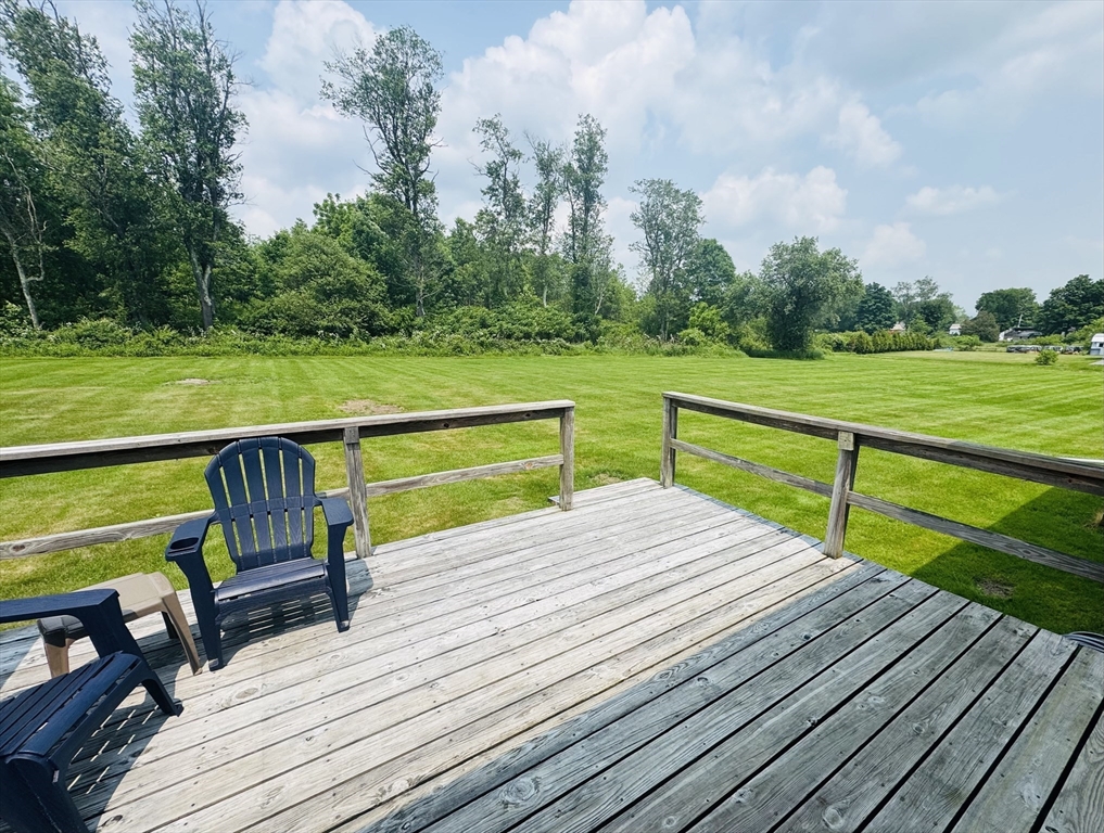 31 Deane Road Bernardston, MA 01337 - Photo 6 of 35 a wooden bench sitting on top of a wooden deck