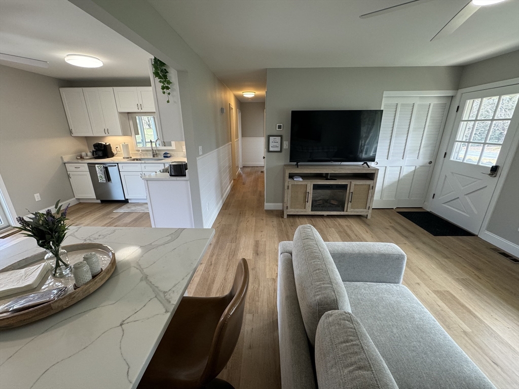 31 Deane Road Bernardston, MA 01337 - Photo 9 of 35 a living room with furniture and a flat screen tv