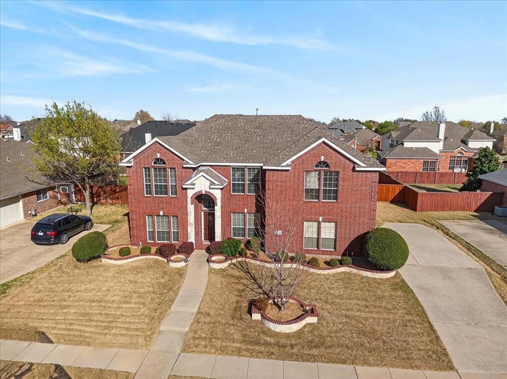 7308 Hawk Lane Sachse, TX 75048 - Photo 2 of 37 a view of a house with a street