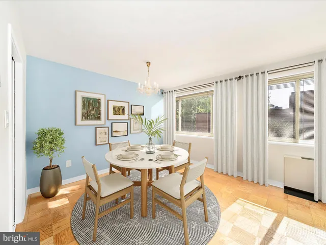 a dining room with furniture and window