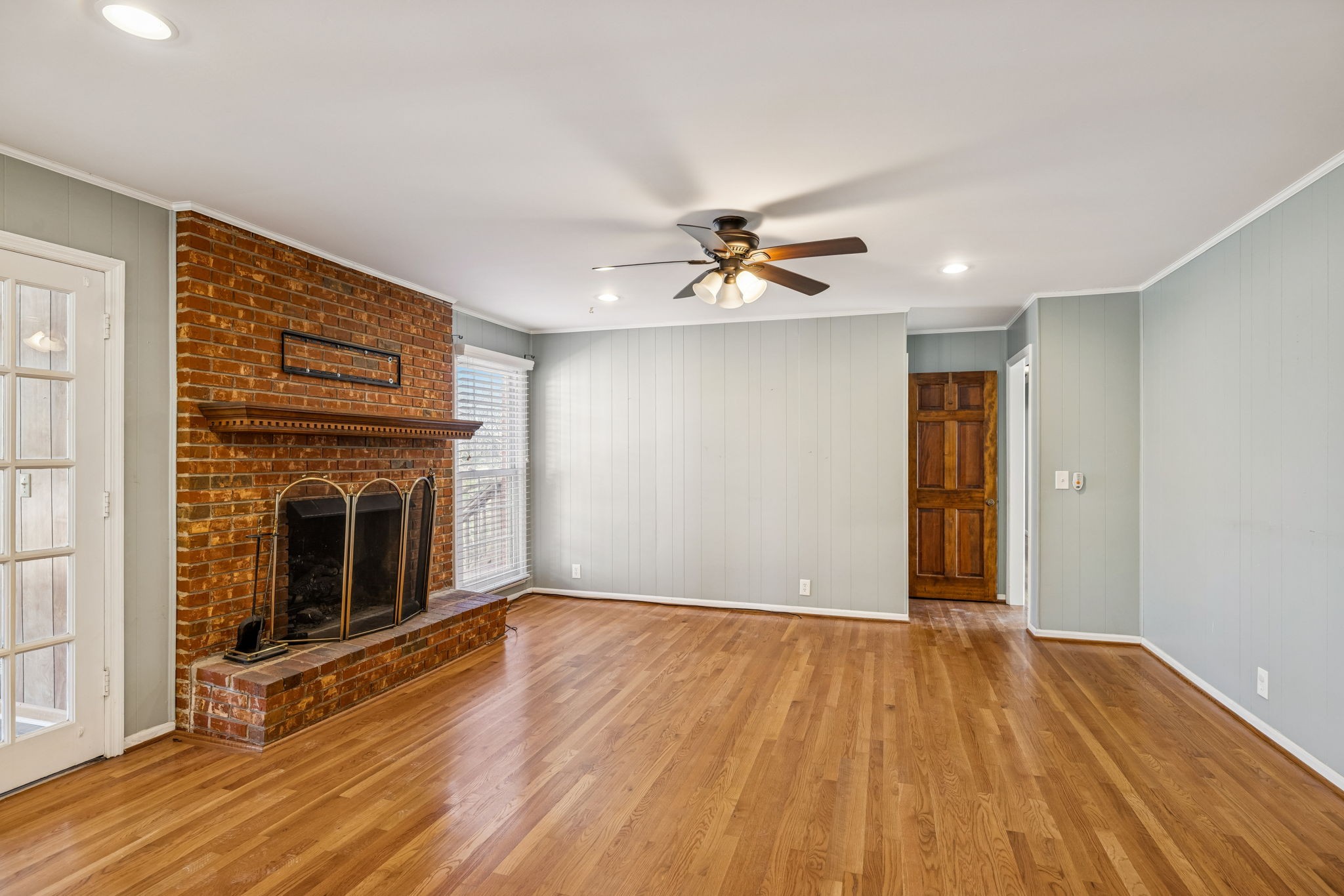 2234 Isaac Lane Franklin, TN 37064 - Photo 17 of 92 a view of an empty room with wooden floor and a fireplace