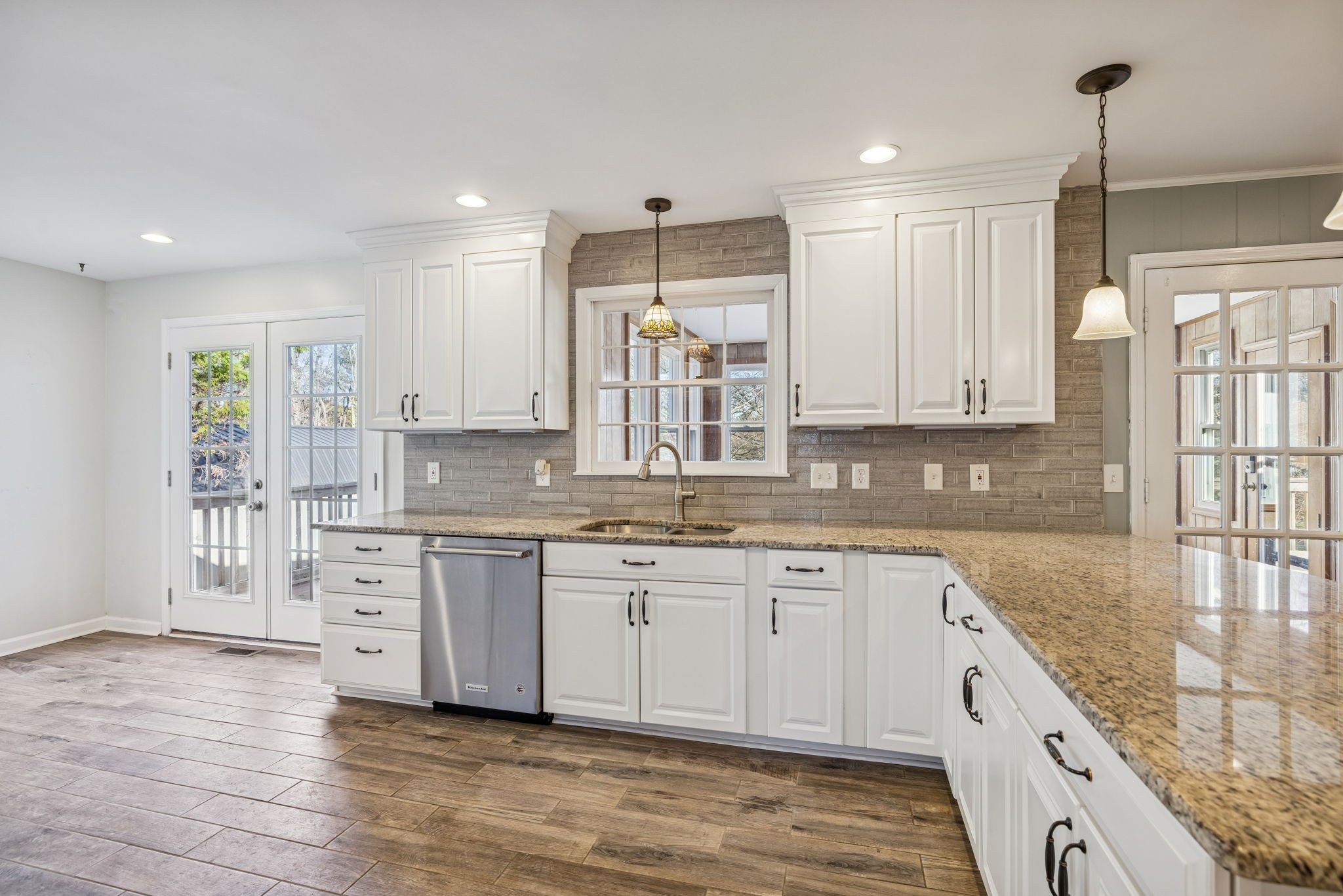 2234 Isaac Lane Franklin, TN 37064 - Photo 24 of 92 a large kitchen with granite countertop a sink and cabinets