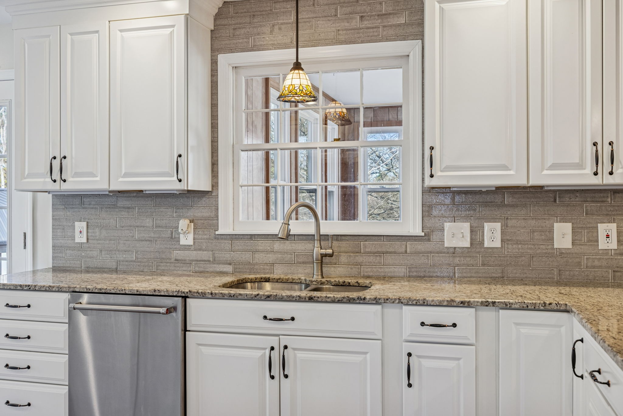 2234 Isaac Lane Franklin, TN 37064 - Photo 25 of 92 a kitchen with granite countertop white cabinets and a sink
