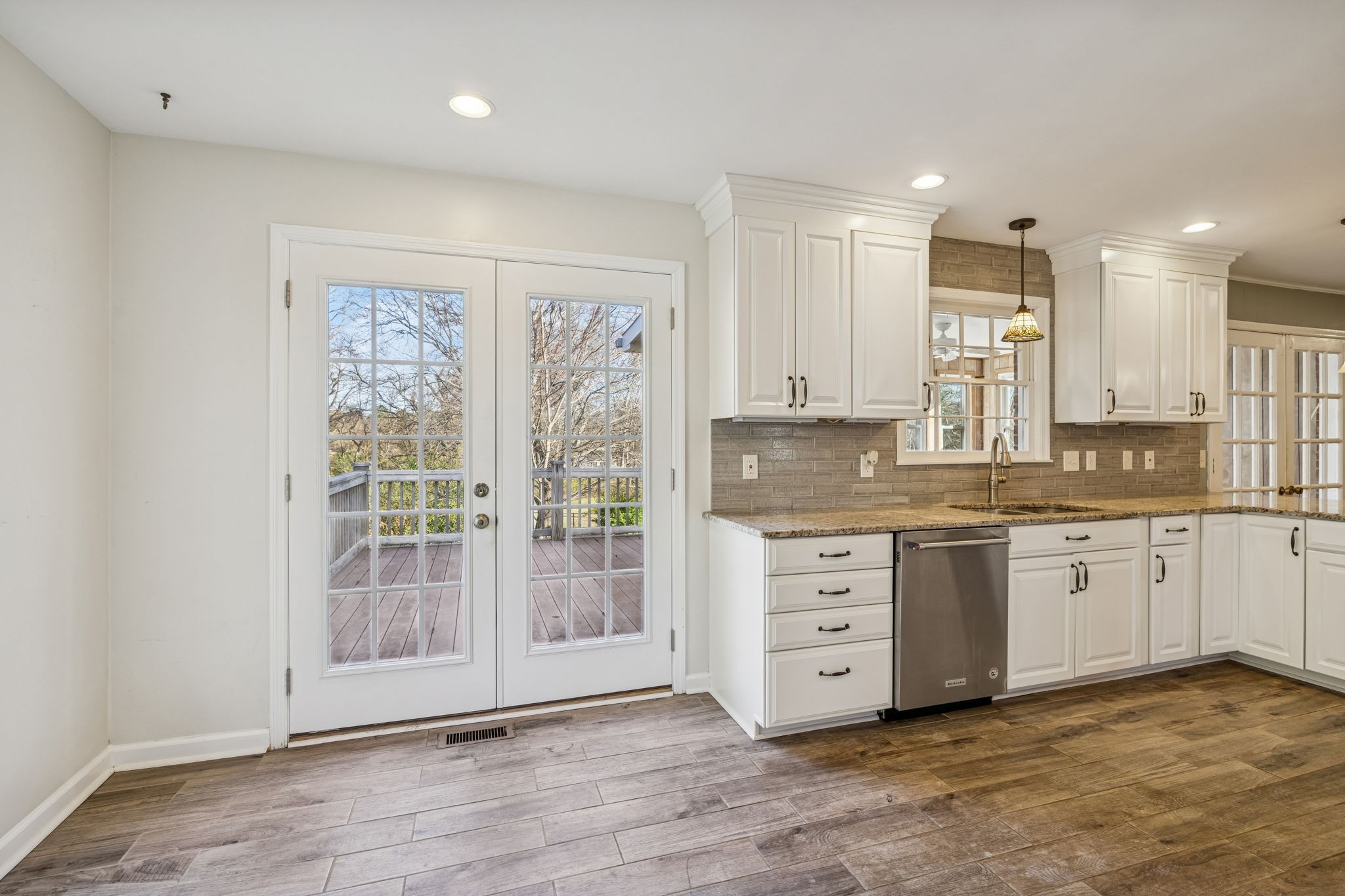 2234 Isaac Lane Franklin, TN 37064 - Photo 32 of 92 a large kitchen with granite countertop a large window and white stainless steel appliances