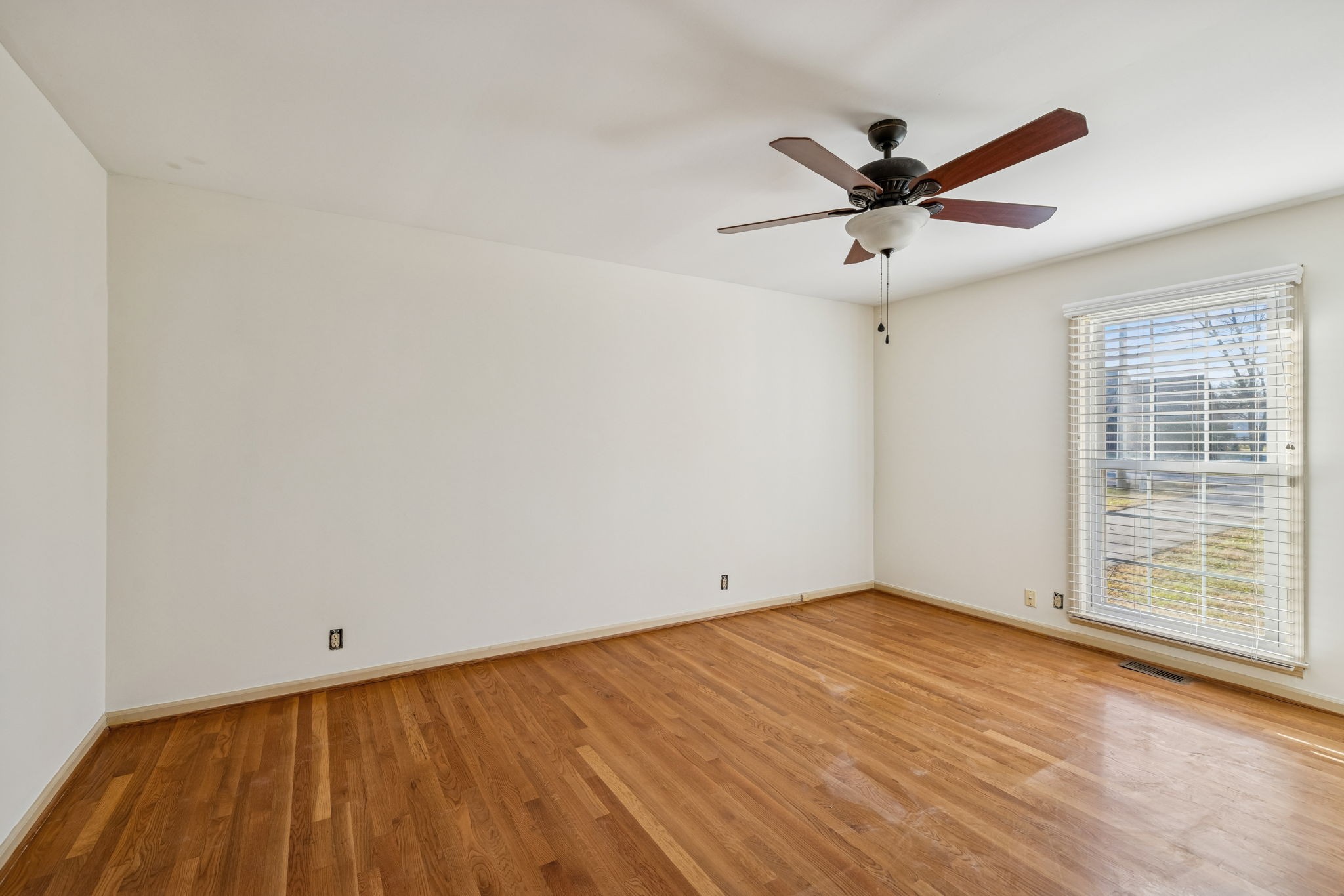 2234 Isaac Lane Franklin, TN 37064 - Photo 42 of 92 a view of an empty room with wooden floor and a window
