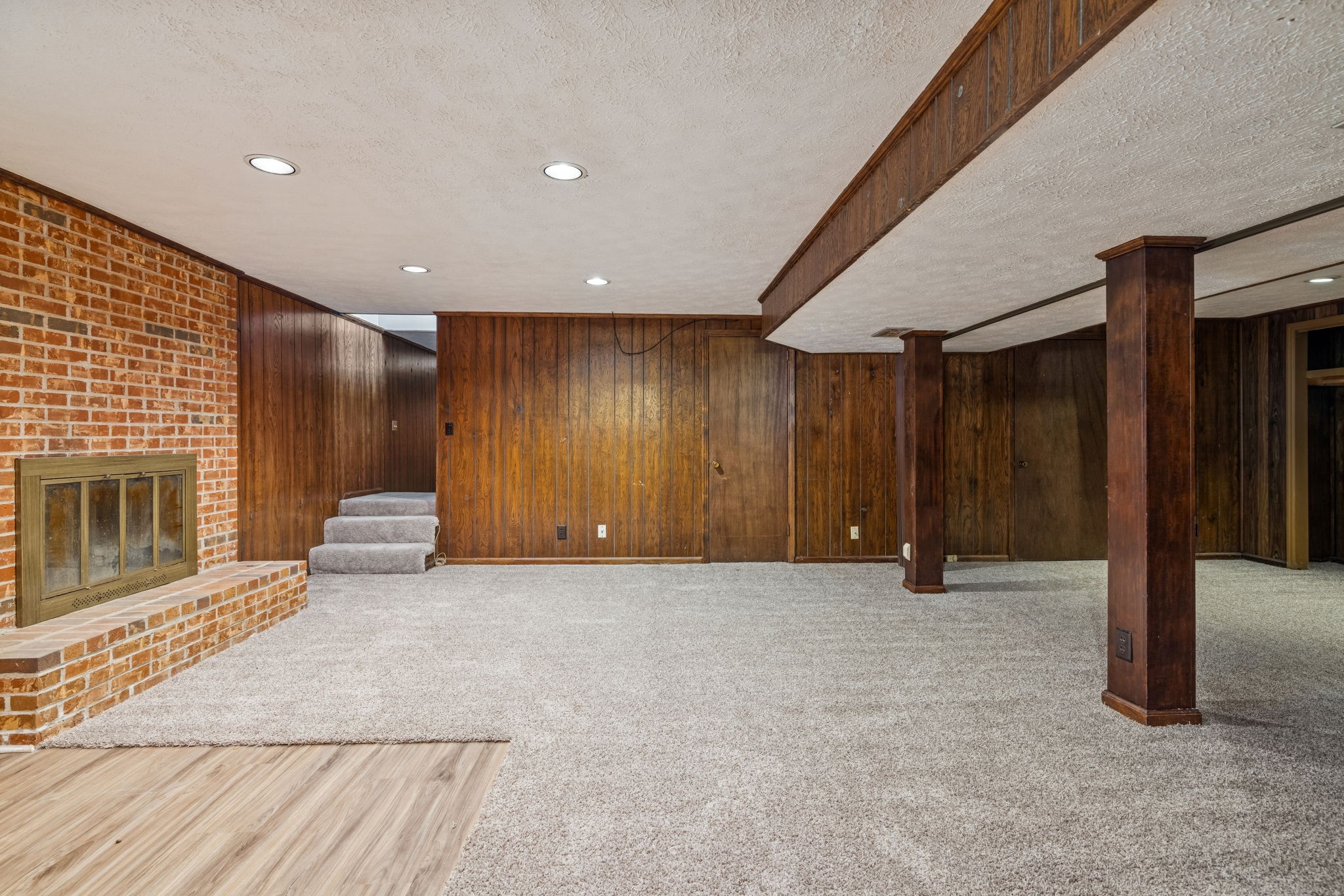 2234 Isaac Lane Franklin, TN 37064 - Photo 54 of 92 a view of an empty room with wooden floor and a fireplace