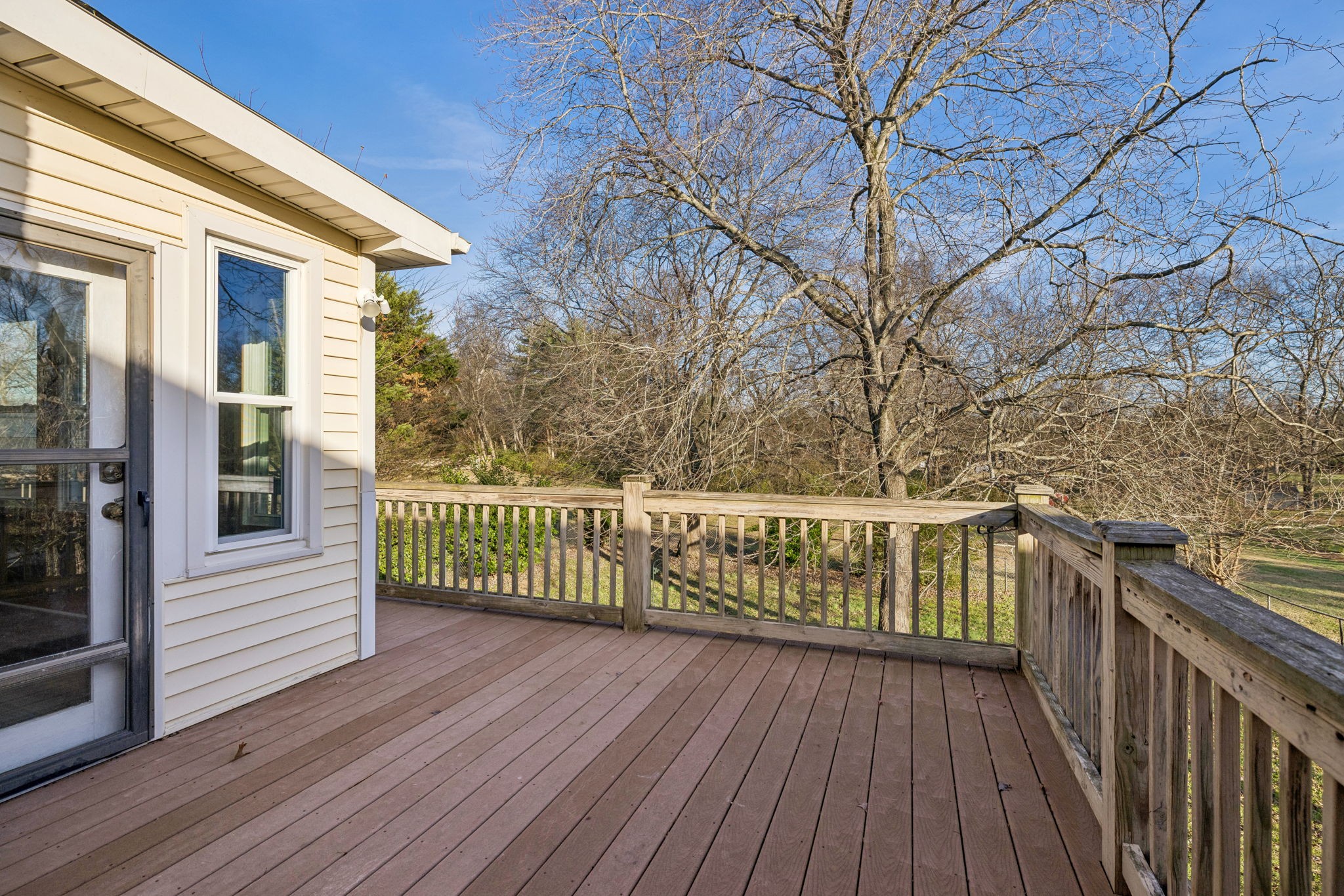 2234 Isaac Lane Franklin, TN 37064 - Photo 66 of 92 a view of a balcony with wooden floor and fence