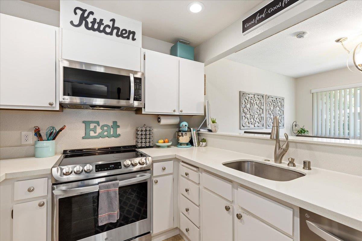 208 Compton Circle, Unit C San Ramon, CA 94583 - Photo 7 of 20 a kitchen with granite countertop a sink cabinets and stainless steel appliances
