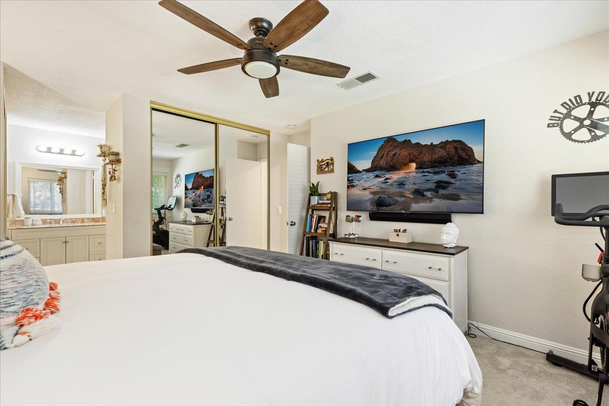 208 Compton Circle, Unit C San Ramon, CA 94583 - Photo 10 of 20 a bedroom with a bed a window and a flat screen tv