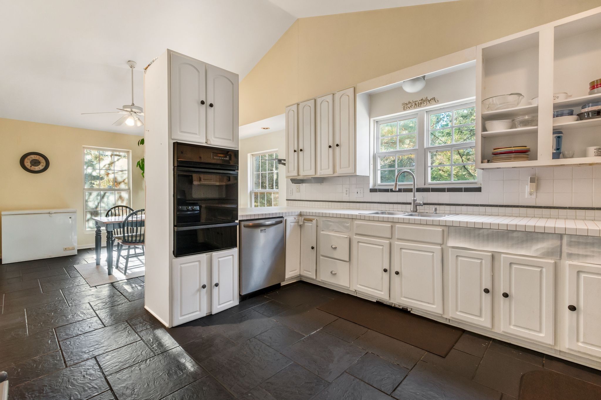 7164 Dice Lampley Road Fairview, TN 37062 - Photo 13 of 42 a kitchen with cabinets and white appliances