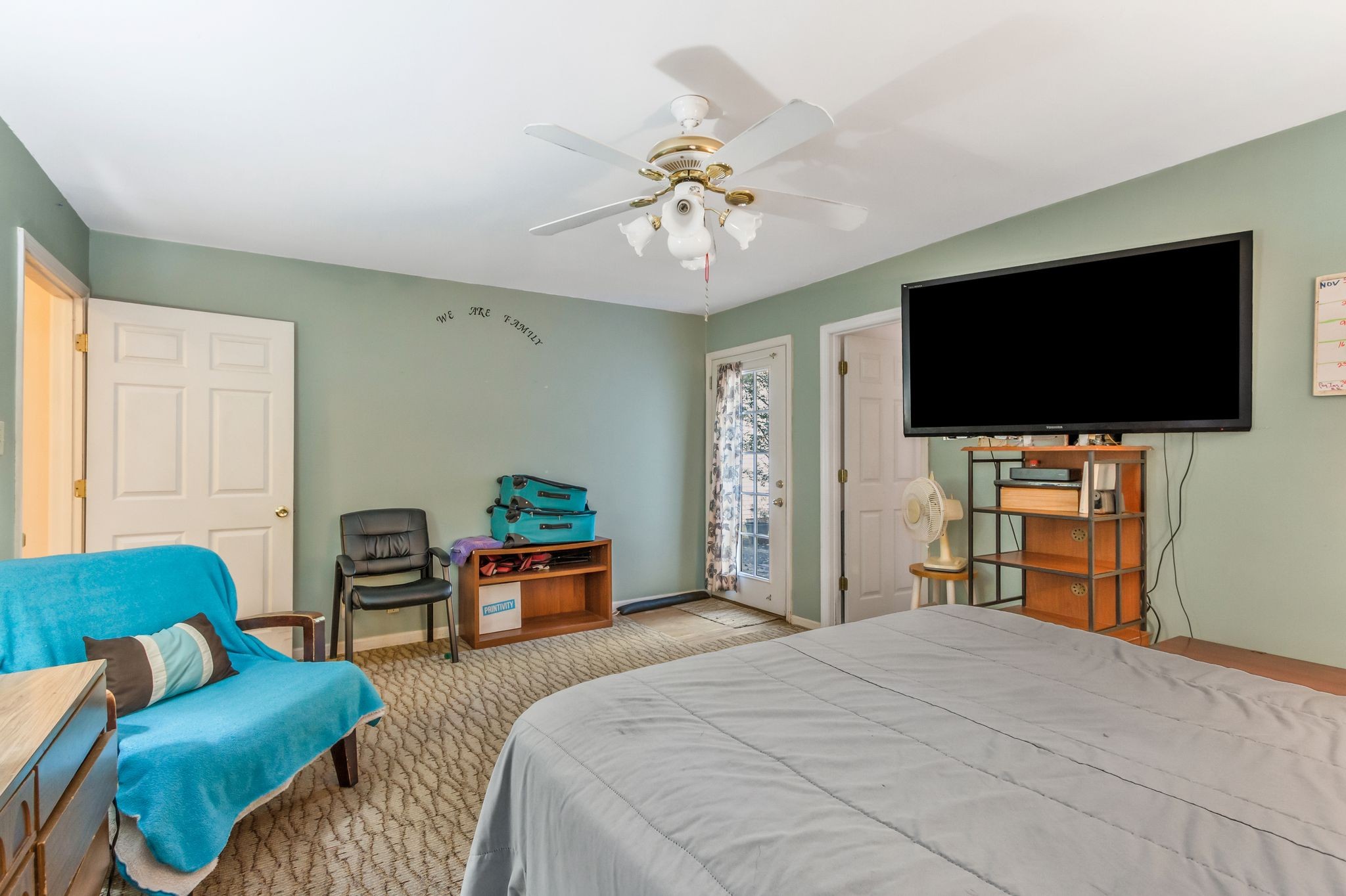 7164 Dice Lampley Road Fairview, TN 37062 - Photo 20 of 42 a bedroom with bed and a flat tv screen on dresser
