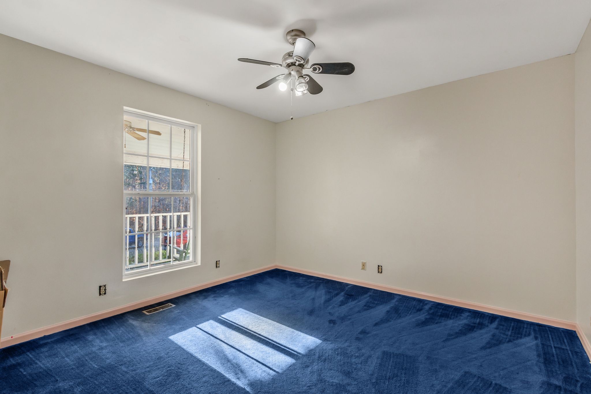7164 Dice Lampley Road Fairview, TN 37062 - Photo 24 of 42 a view of an empty room with wooden floor and a window