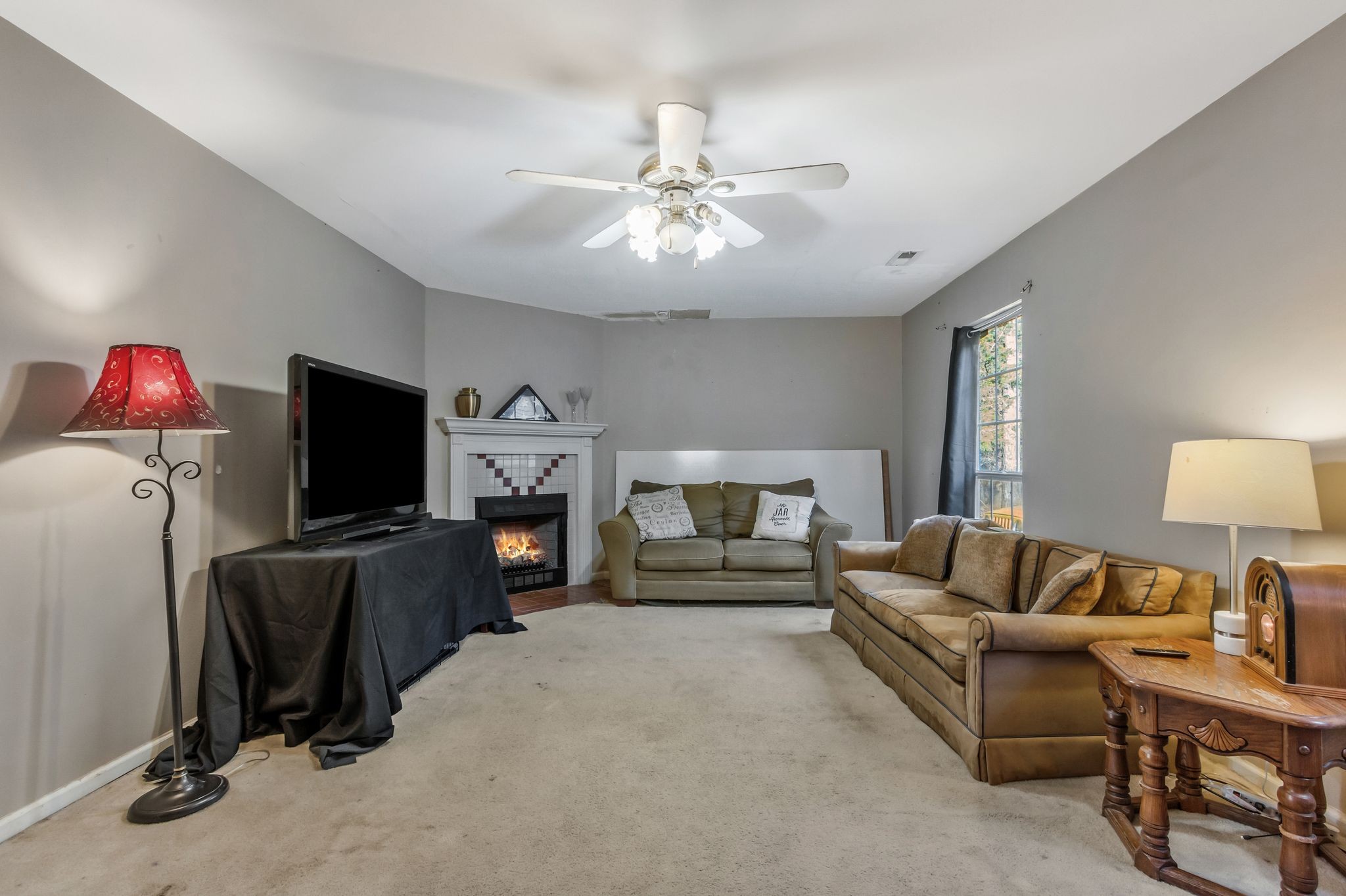 7164 Dice Lampley Road Fairview, TN 37062 - Photo 31 of 42 a living room with furniture and a flat screen tv