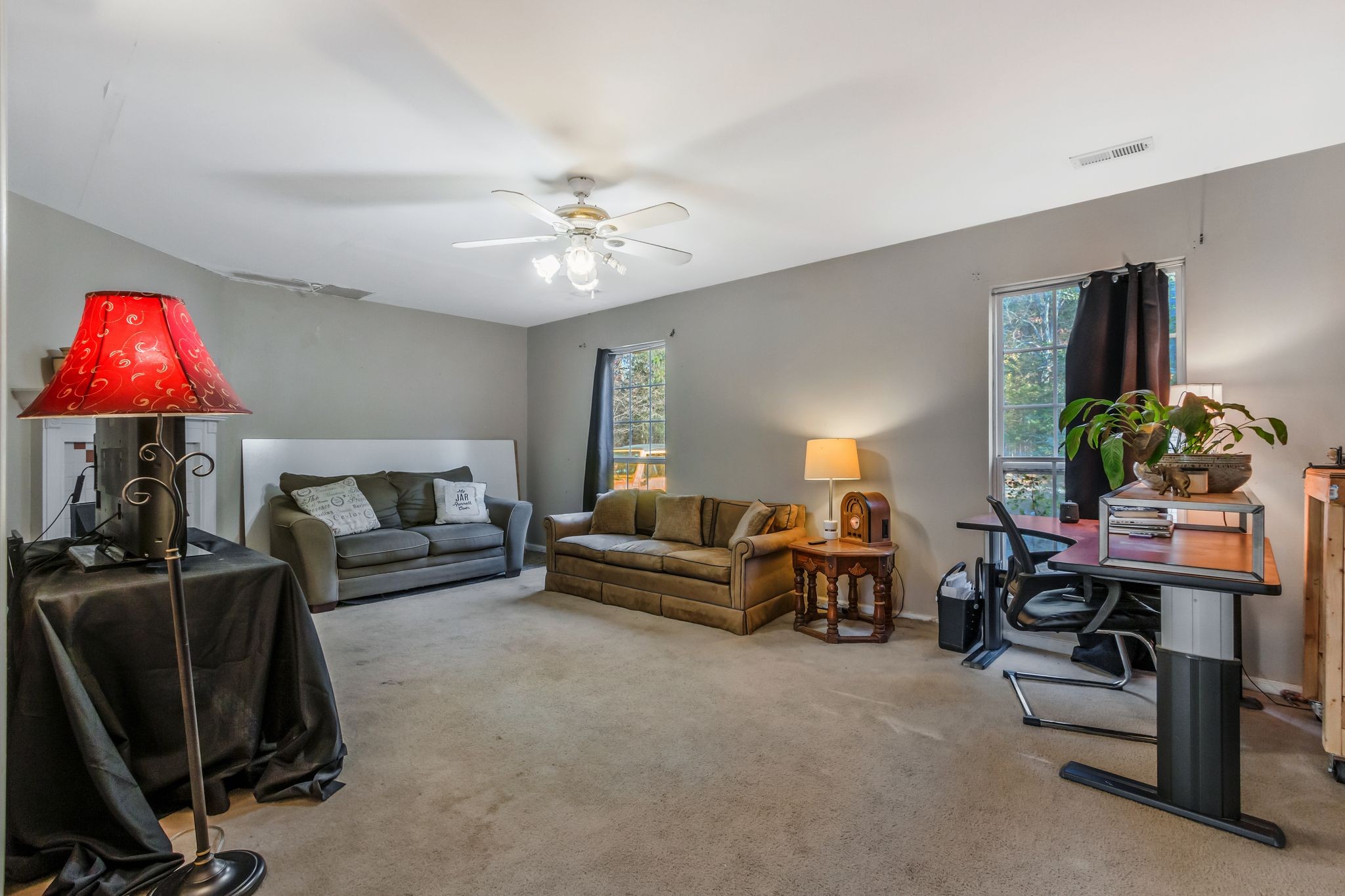7164 Dice Lampley Road Fairview, TN 37062 - Photo 32 of 42 a living room with furniture a chandelier and a flat screen tv