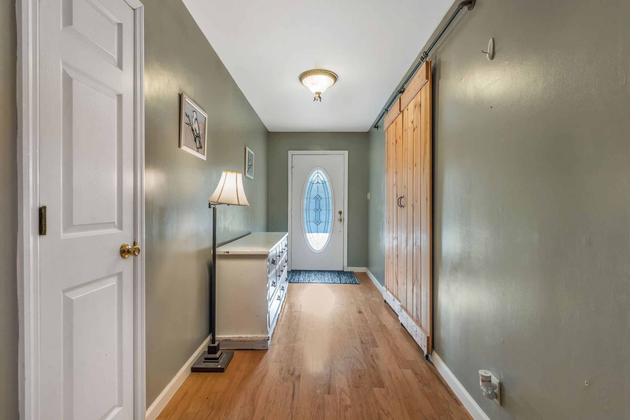 7164 Dice Lampley Road Fairview, TN 37062 - Photo 10 of 42 a view of a hallway with wooden floor