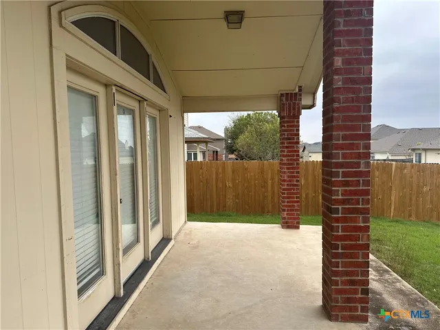 a view of a door and a yard