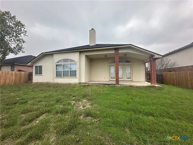 a house view with a garden space
