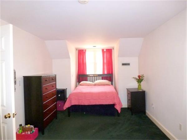 293 Concord Road Bedford, MA 01730 - Photo 16 of 20 a bedroom with a bed and a dresser