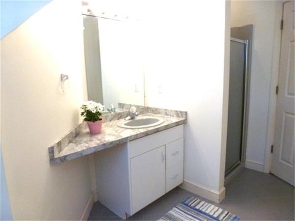293 Concord Road Bedford, MA 01730 - Photo 17 of 20 a bathroom with a sink and a mirror