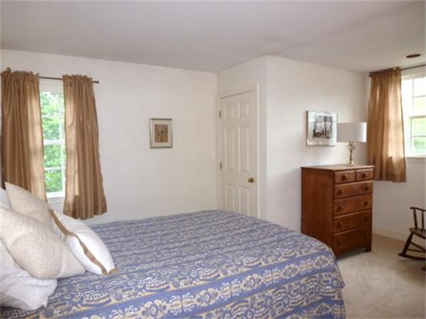 293 Concord Road Bedford, MA 01730 - Photo 19 of 20 a bedroom with a bed and a window