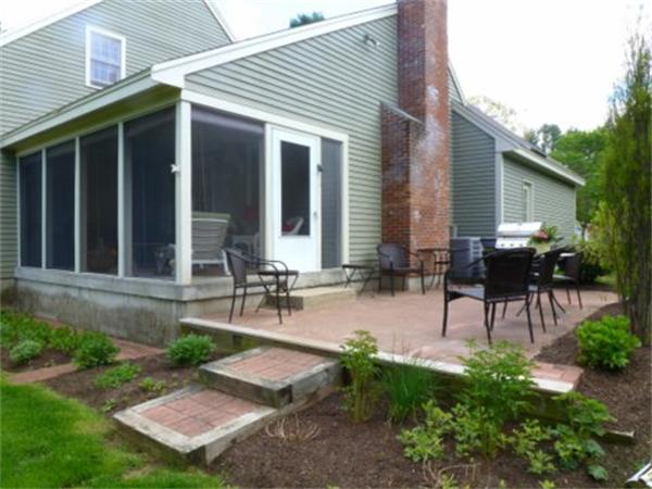 293 Concord Road Bedford, MA 01730 - Photo 3 of 20 a view of a backyard with sitting area