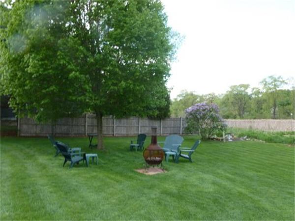 293 Concord Road Bedford, MA 01730 - Photo 5 of 20 a backyard of a house with table and chairs