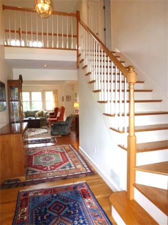 293 Concord Road Bedford, MA 01730 - Photo 6 of 20 a view of entryway and hall with wooden floor