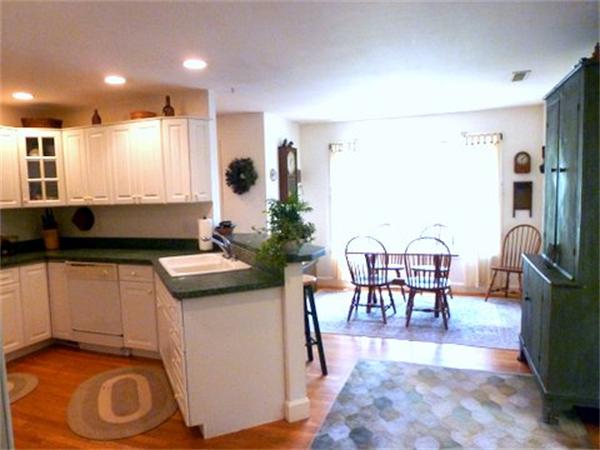 293 Concord Road Bedford, MA 01730 - Photo 8 of 20 a living room with furniture a dining table and kitchen view