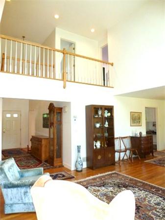 293 Concord Road Bedford, MA 01730 - Photo 10 of 20 a living room with a rug and a table