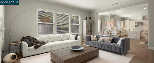 a large kitchen with cabinets and a dining table