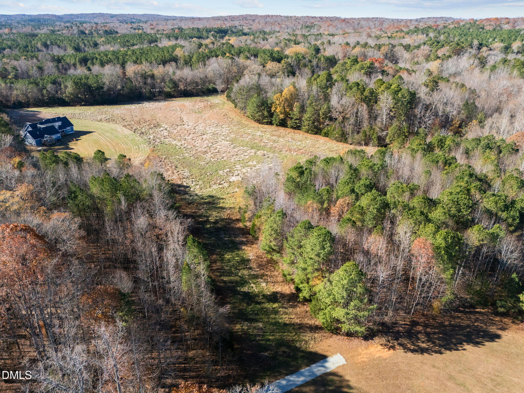7884 South Lowell Road Bahama, NC 27503 - Photo 7 of 12 a view of a lake with trees in the background
