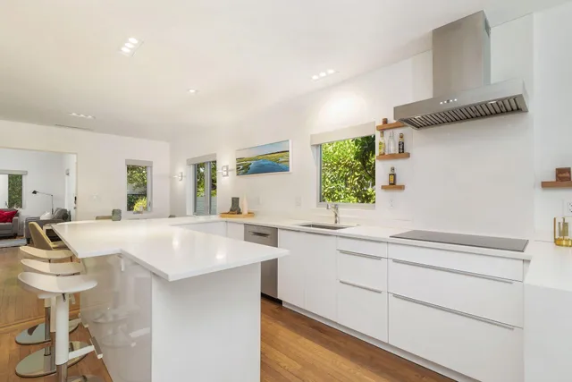a kitchen with a sink stainless steel appliances and cabinets