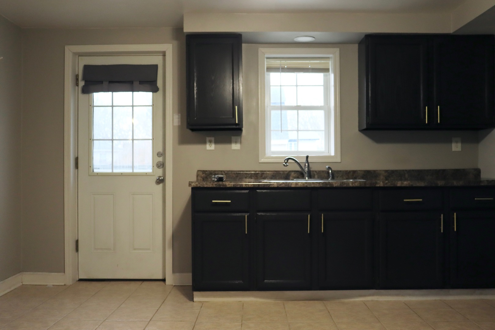 5N769 Pearson Drive, Unit 2 Wayne, IL 60184 - Photo 3 of 15 a kitchen with a sink a window and cabinets