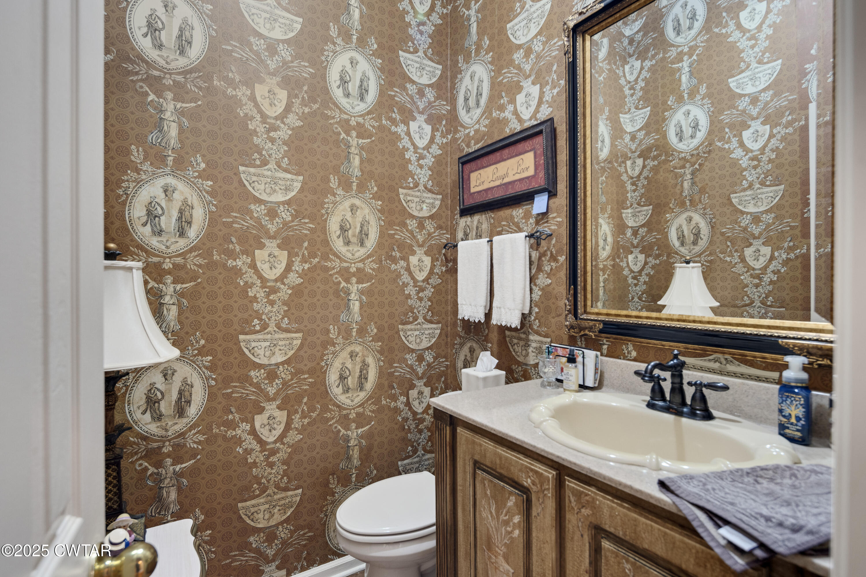 1647 Forsythe Trail Collierville, TN 38017 - Photo 15 of 32 a bathroom with a granite countertop toilet sink and mirror