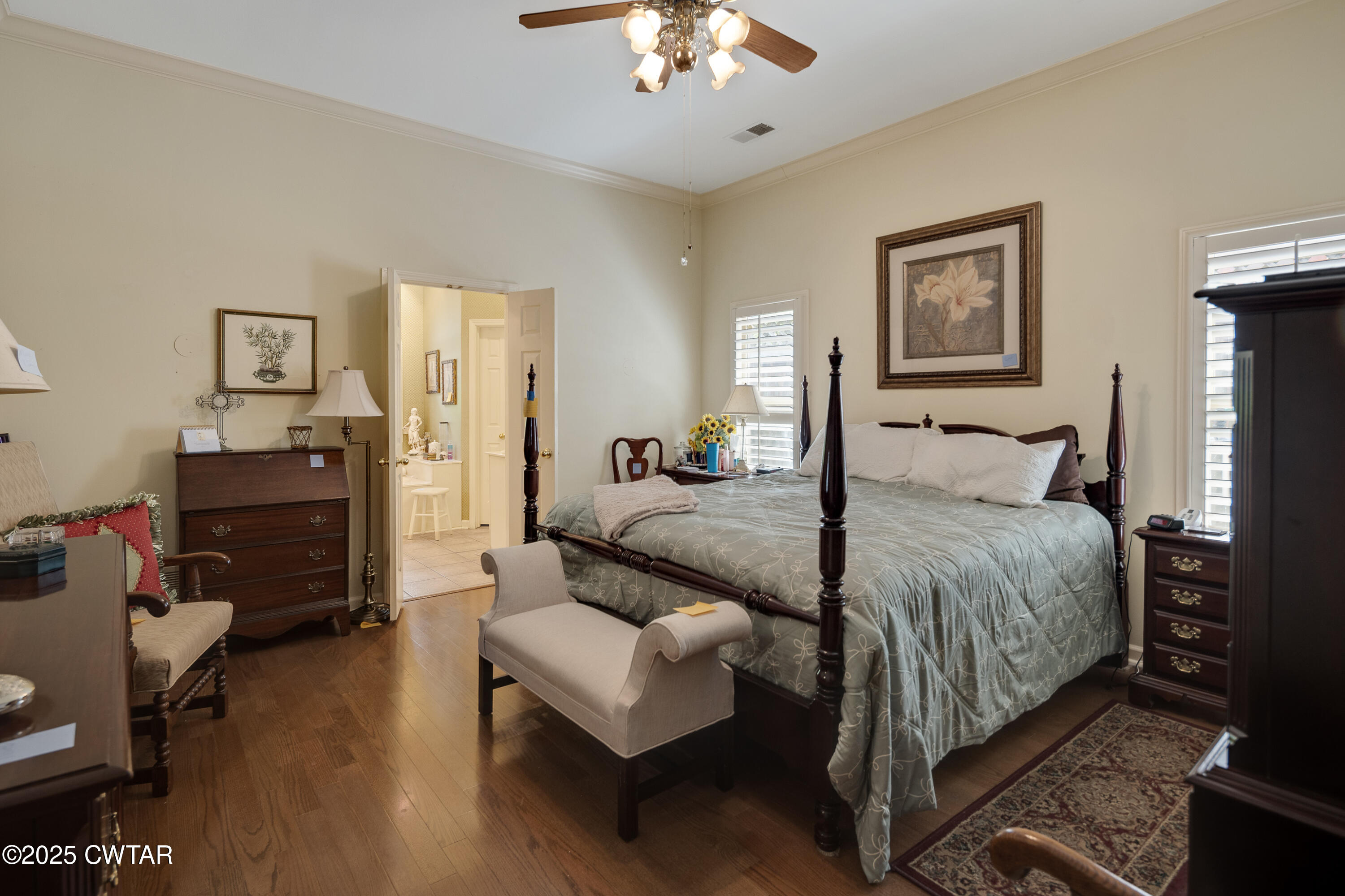 1647 Forsythe Trail Collierville, TN 38017 - Photo 17 of 32 a bedroom with a bed and a chandelier