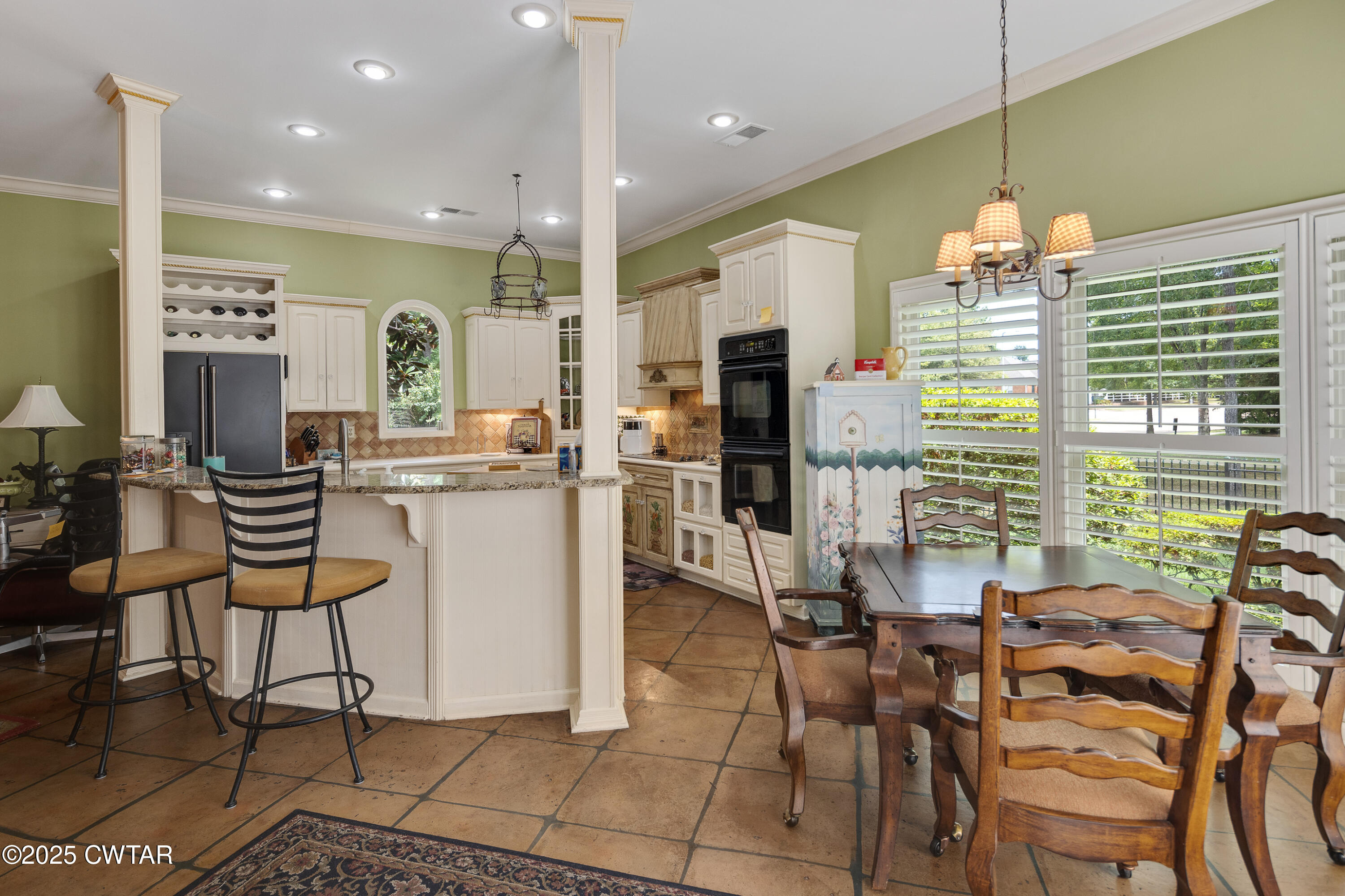 1647 Forsythe Trail Collierville, TN 38017 - Photo 10 of 32 a dining room filled with furniture and a chandelier