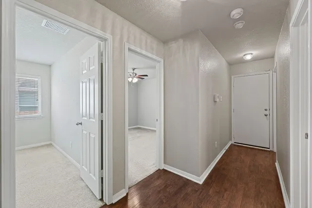 wooden floor with white walls