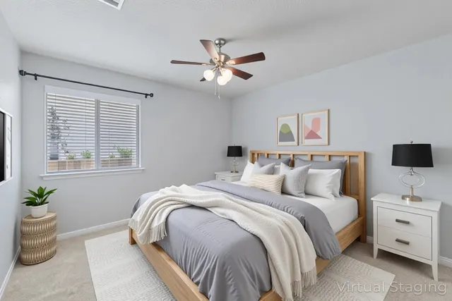 a bedroom with bed and a window