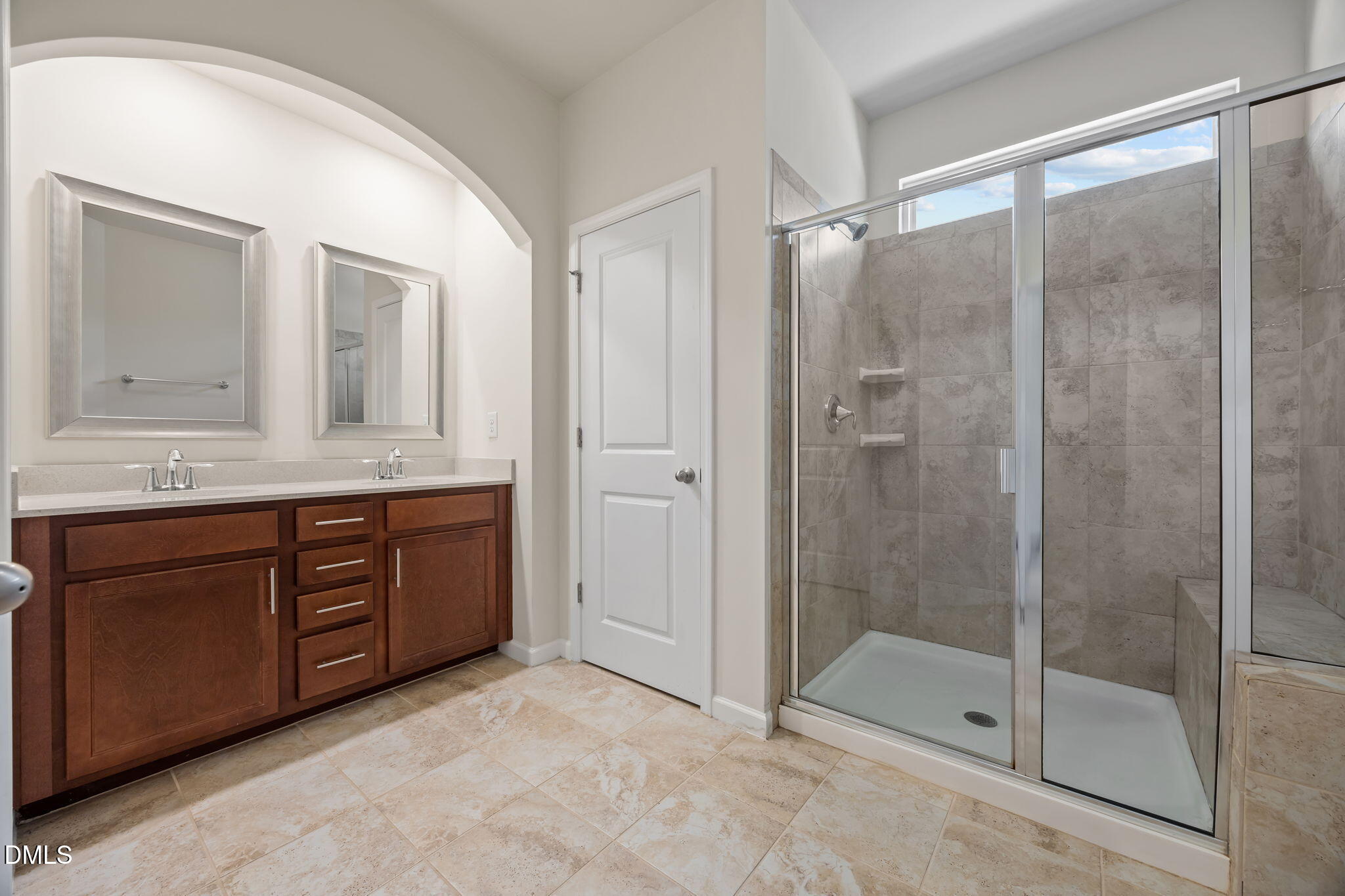 1005 Epiphany Road Morrisville, NC 27560 - Photo 15 of 23 a bathroom with a shower sink and mirror